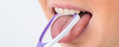 Usage and Benefits of a Tongue Scraper